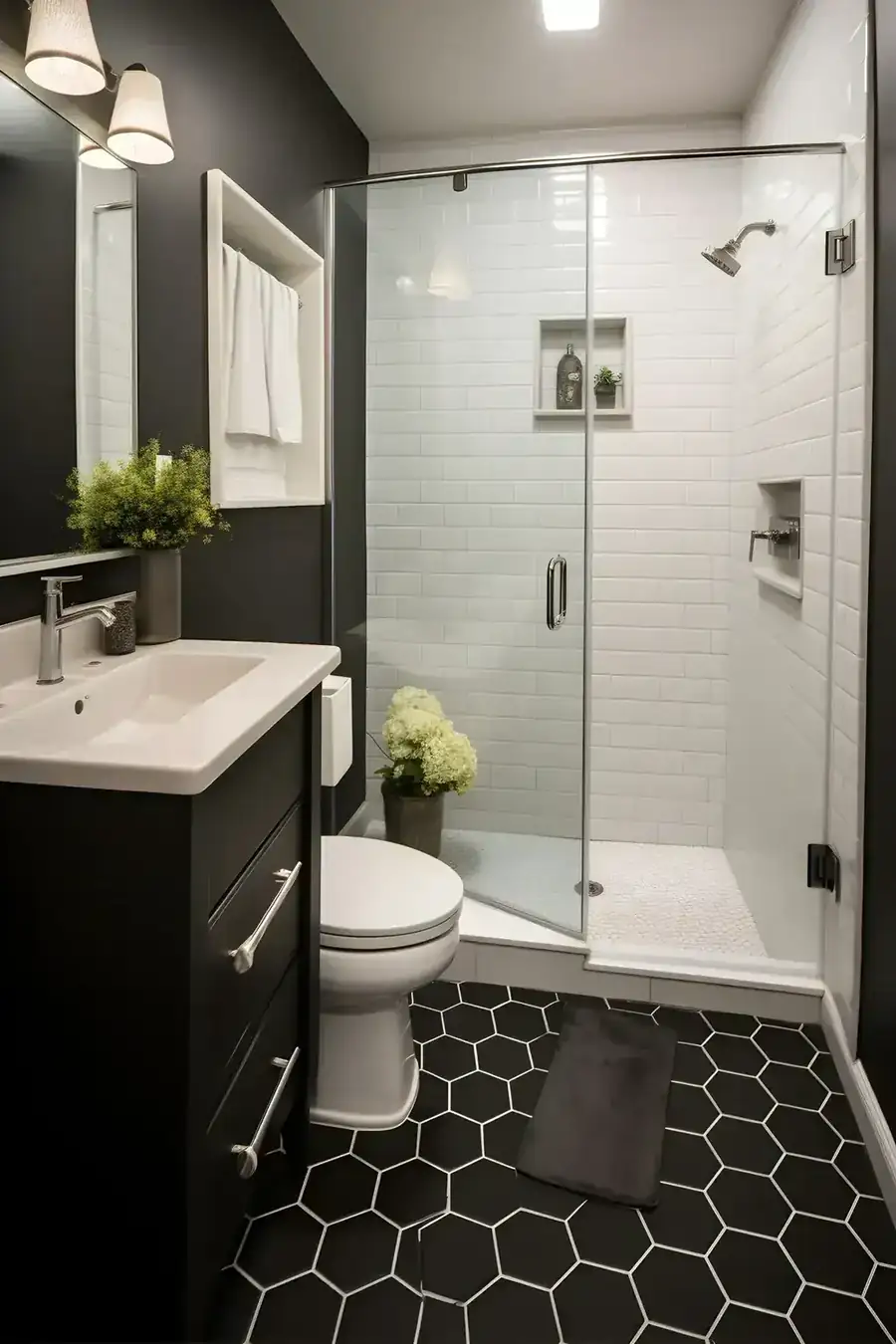 Elm Springs walk-in shower with white subway walls, frameless glass and a black hexagon floor