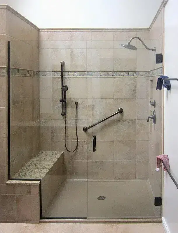 Tile-look shower walls with a built-in bench and a grab bar